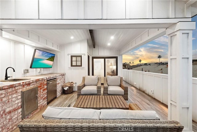 725 Dover Ct, San Diego, CA 92109 - interior space featuring light wood-style floors, a decorative wall, and lofted ceiling with beams
