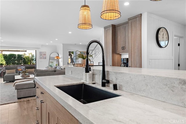 725 Dover Ct, San Diego, CA 92109 - kitchen featuring a sink, light stone counters, and recessed lighting