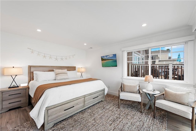 bedroom with baseboards, wood finished floors, and recessed lighting