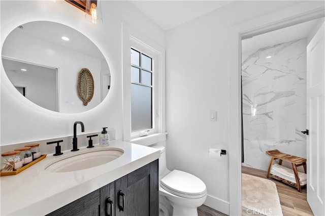 725 Dover Ct, San Diego, CA 92109 - full bath featuring vanity, toilet, a marble finish shower, and wood finished floors