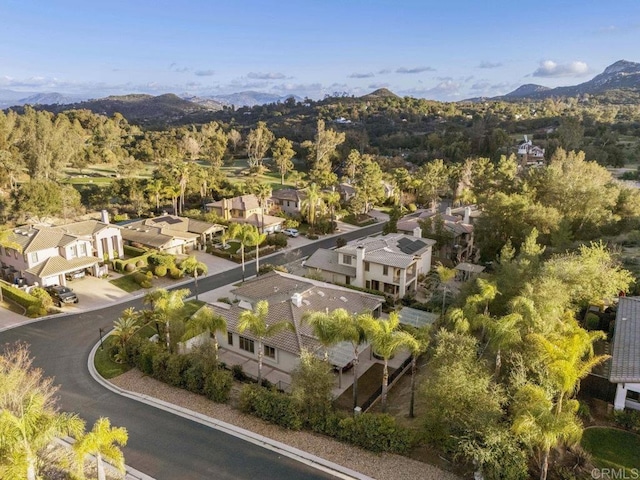 drone / aerial view featuring a residential view and a mountain view