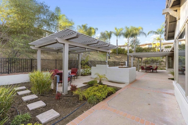 view of patio / terrace featuring a fenced backyard and a pergola