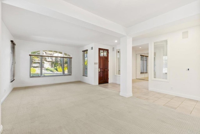 interior space featuring light tile patterned floors, recessed lighting, light colored carpet, visible vents, and baseboards