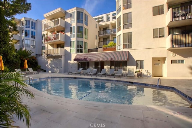 community pool featuring a patio area