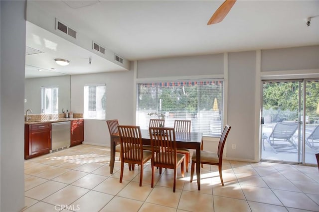 dining area with visible vents, baseboards, and light tile patterned flooring