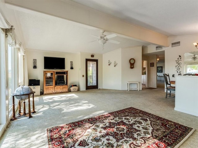 living room with carpet floors, visible vents, and ornamental molding