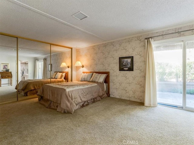 bedroom featuring access to outside, carpet flooring, visible vents, and wallpapered walls