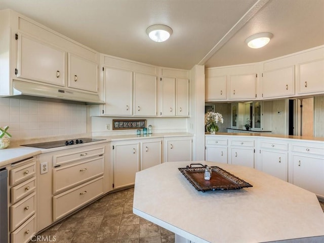 kitchen featuring light countertops, white cabinetry, black electric cooktop, and under cabinet range hood