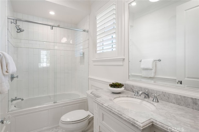 full bath featuring toilet, shower / bath combination with glass door, recessed lighting, and vanity