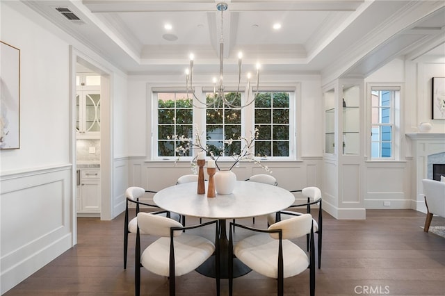 dining room with beamed ceiling, a decorative wall, dark wood-style flooring, and a notable chandelier