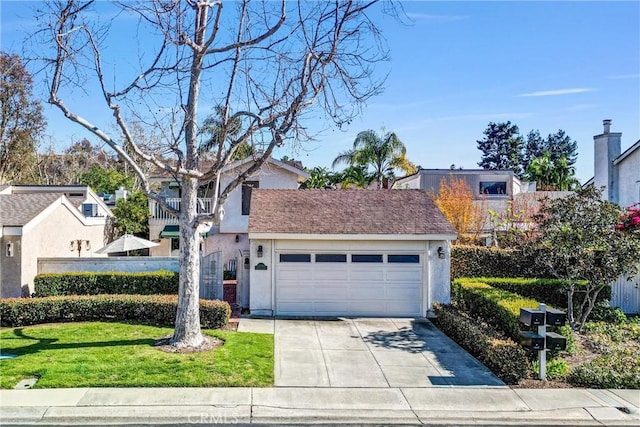 view of front facade with a garage, a shingled roof, concrete driveway, stucco siding, and a front yard