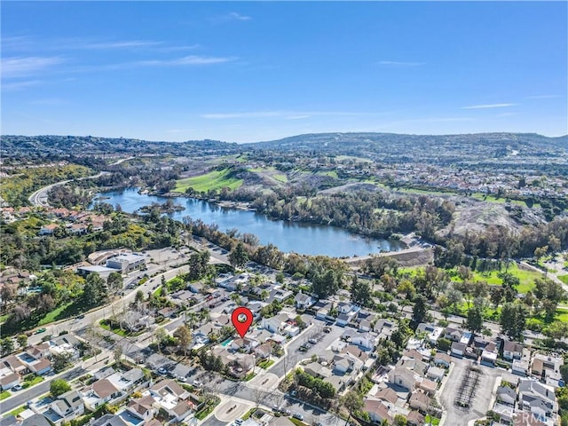 birds eye view of property with a residential view and a water view