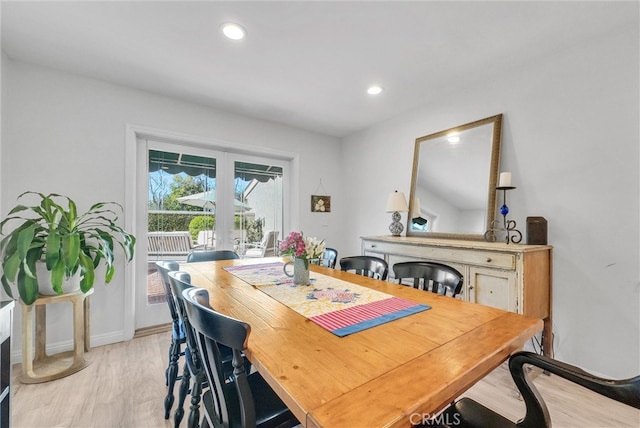 dining space with light wood-style floors, baseboards, and recessed lighting