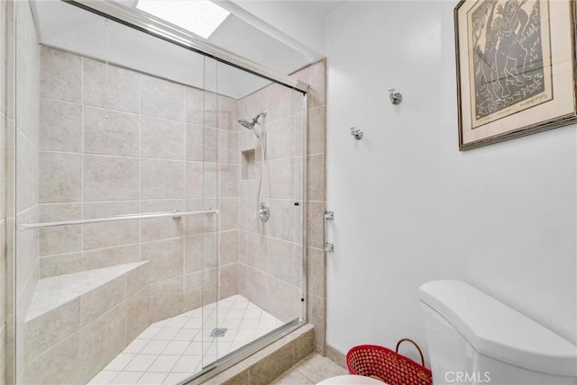 full bath with toilet and a shower stall