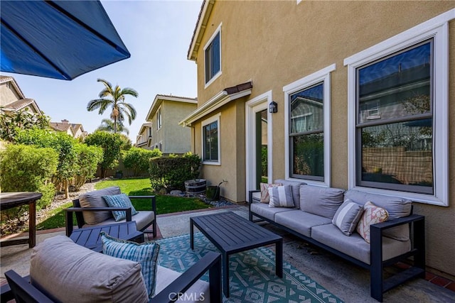 view of patio with outdoor lounge area and fence