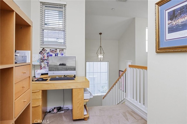 office area with lofted ceiling and carpet