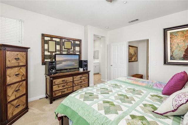 bedroom with visible vents, baseboards, and light carpet