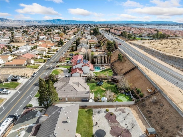 birds eye view of property with a mountain view and a residential view