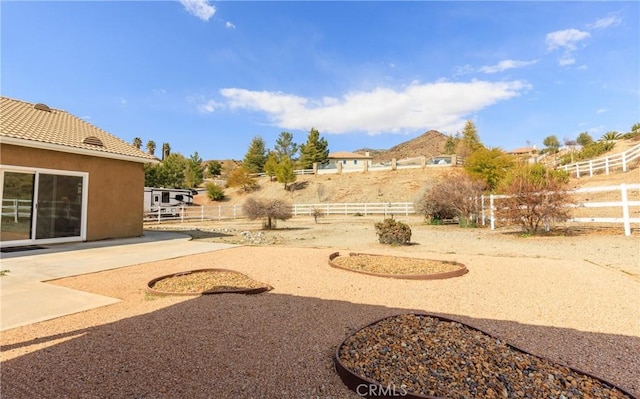 view of yard with a patio and fence