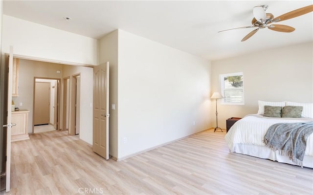 bedroom with a ceiling fan and light wood-style floors