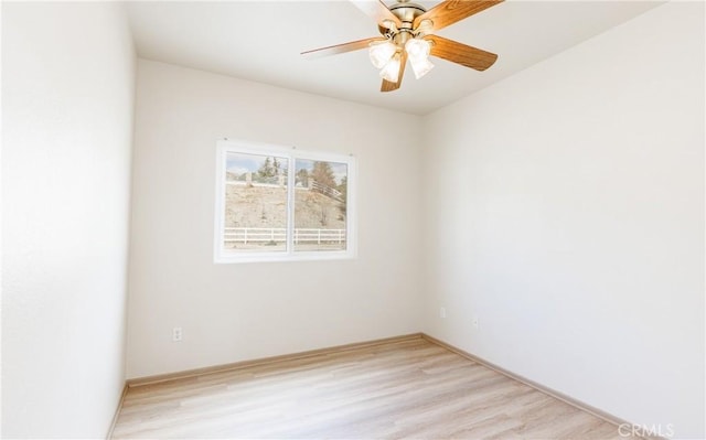 empty room featuring ceiling fan and light wood-style flooring