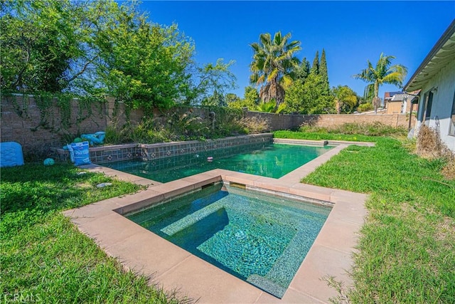 view of pool featuring an in ground hot tub, a yard, a fenced backyard, and a fenced in pool