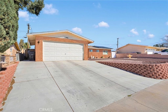 ranch-style house with an attached garage, central AC, fence, and concrete driveway