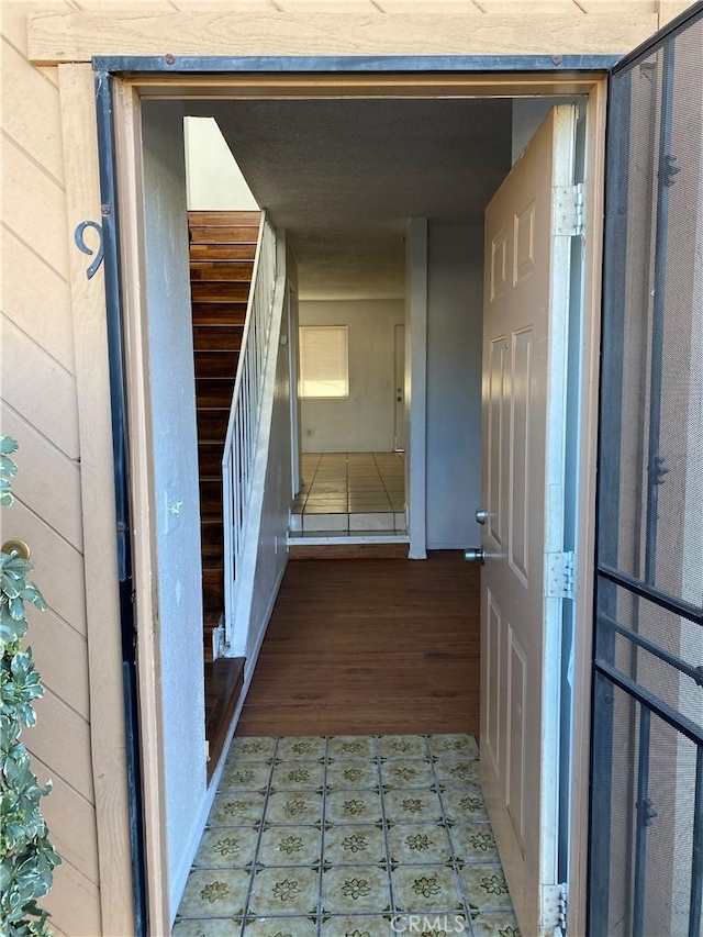 corridor featuring stairway