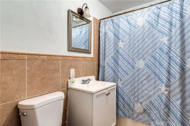 bathroom featuring vanity, tile walls, toilet, and a shower with shower curtain