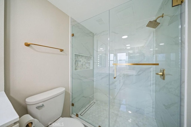 full bathroom featuring a marble finish shower and toilet