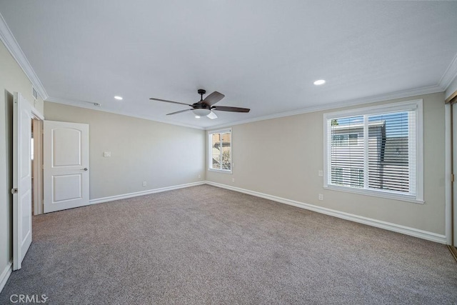 carpeted spare room featuring baseboards, ceiling fan, recessed lighting, and crown molding