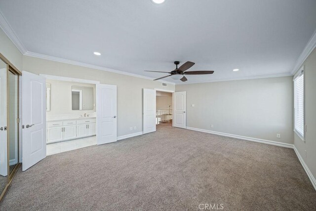 unfurnished bedroom featuring ornamental molding, carpet flooring, and baseboards