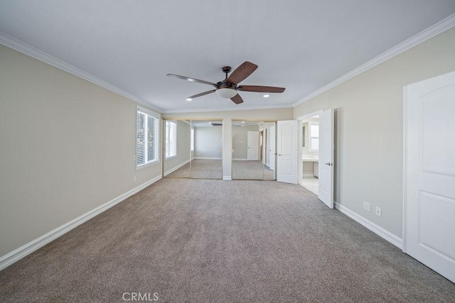 unfurnished bedroom featuring light carpet, baseboards, connected bathroom, crown molding, and two closets