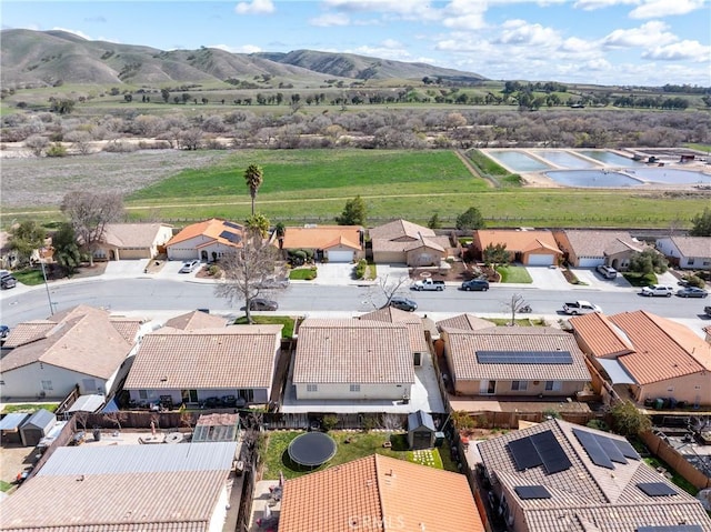bird's eye view with a residential view and a mountain view