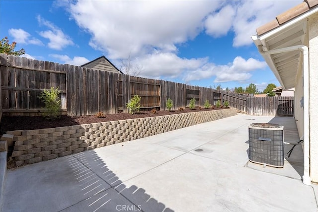 view of patio featuring a fenced backyard and central air condition unit