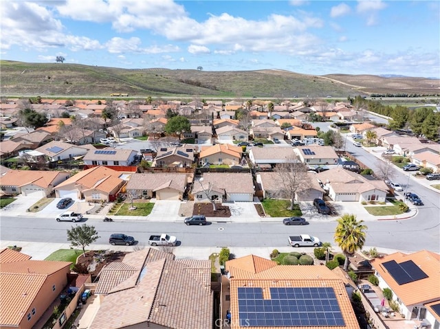 drone / aerial view featuring a mountain view and a residential view