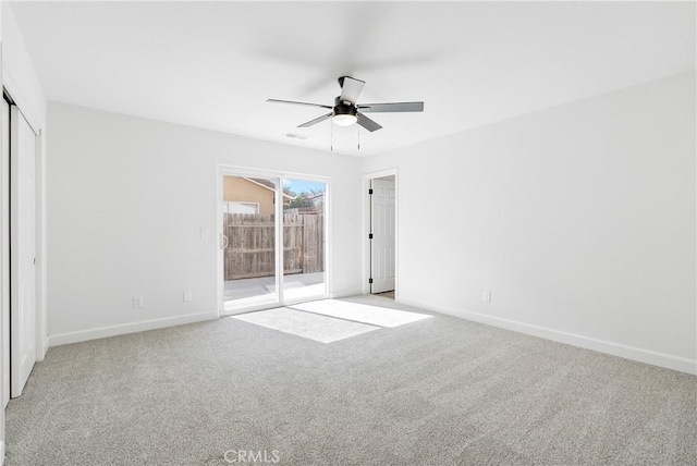 unfurnished bedroom featuring access to exterior, light carpet, baseboards, and a ceiling fan