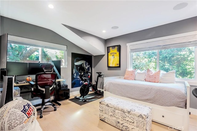 bedroom featuring vaulted ceiling, recessed lighting, and wood finished floors