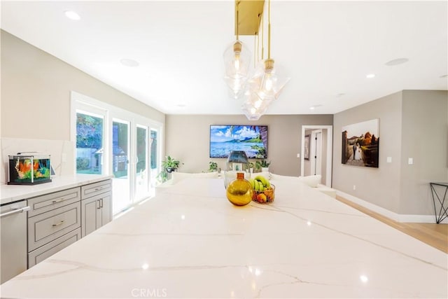 dining area with recessed lighting, baseboards, and wood finished floors