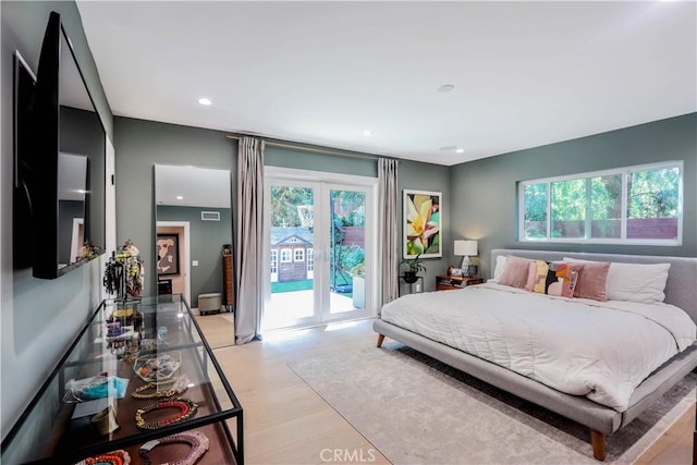 bedroom with access to exterior, visible vents, recessed lighting, and light wood-style floors