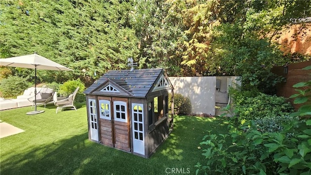 view of shed with a fenced backyard