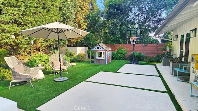 view of patio featuring fence