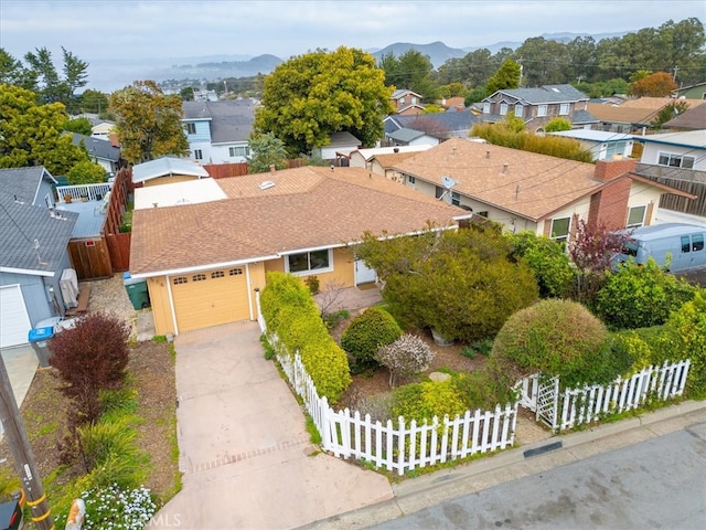 birds eye view of property with a mountain view and a residential view