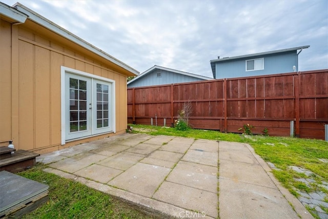 view of patio / terrace with fence and french doors