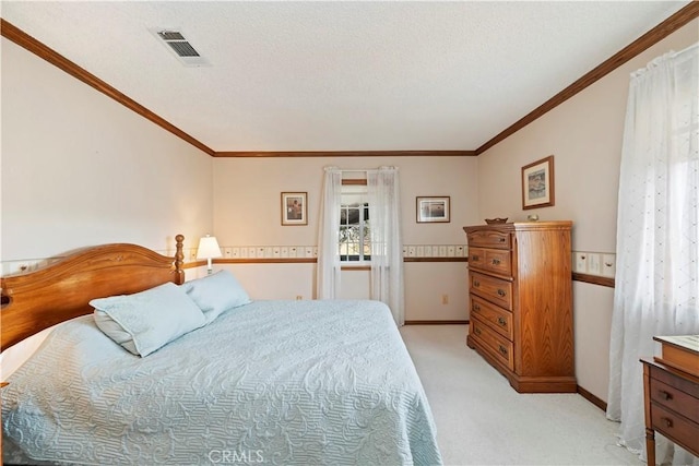 bedroom featuring light colored carpet, visible vents, ornamental molding, a textured ceiling, and baseboards