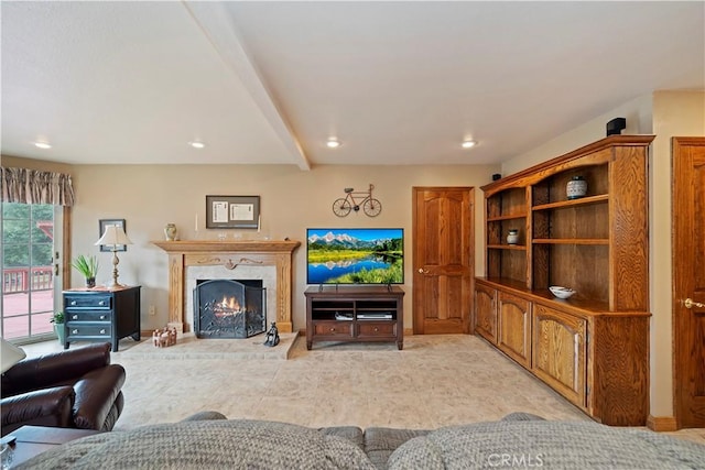 living area featuring baseboards, beam ceiling, a high end fireplace, and recessed lighting