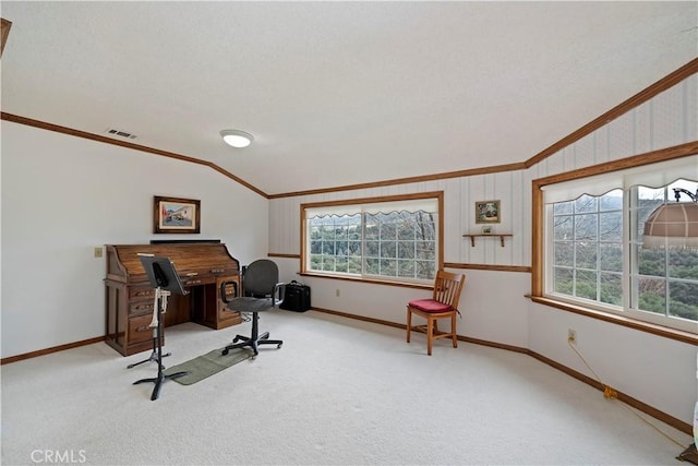 carpeted office space with vaulted ceiling, baseboards, visible vents, and crown molding