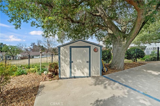 view of shed with fence