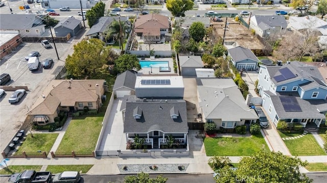 birds eye view of property with a residential view