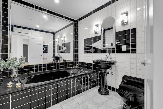 full bathroom with toilet, tile walls, tile patterned flooring, and a tub with jets